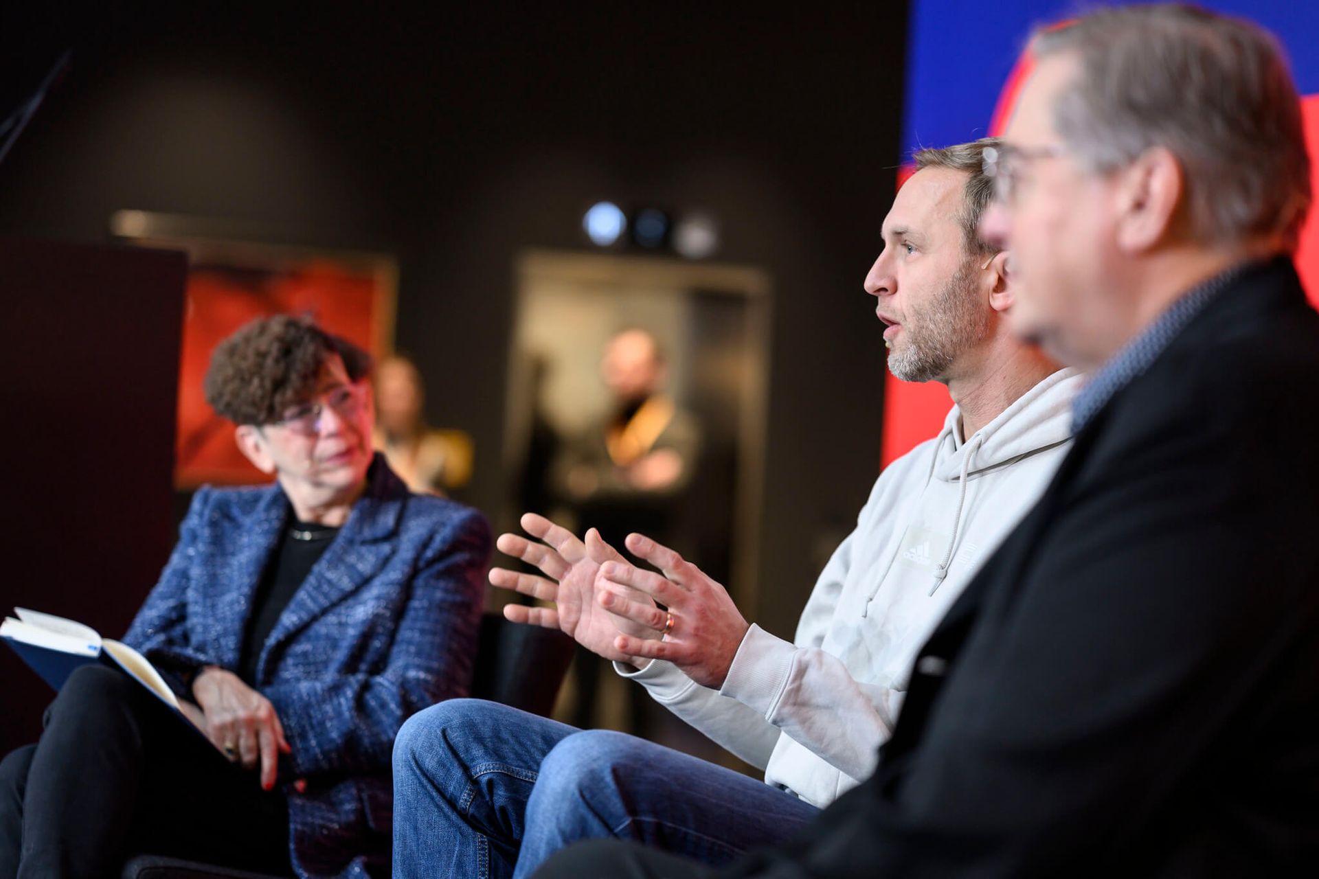 (L-R) Jennifer Schenker, Bjoern Eskofier and Greg Lavender speak at the DLD Munich Conference 2025 in Munich